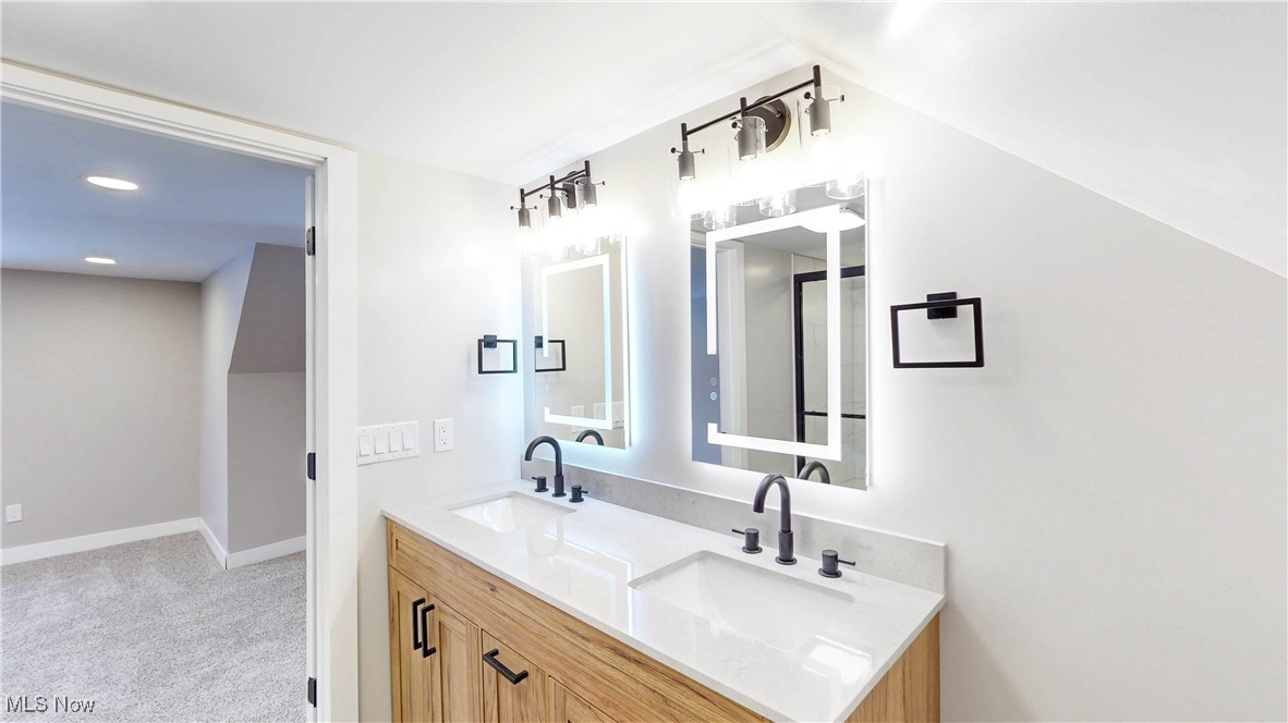 2978 Long Road Uniontown, OH 44685 - Photo 36 of 40 Full bath featuring double vanity and light carpet
