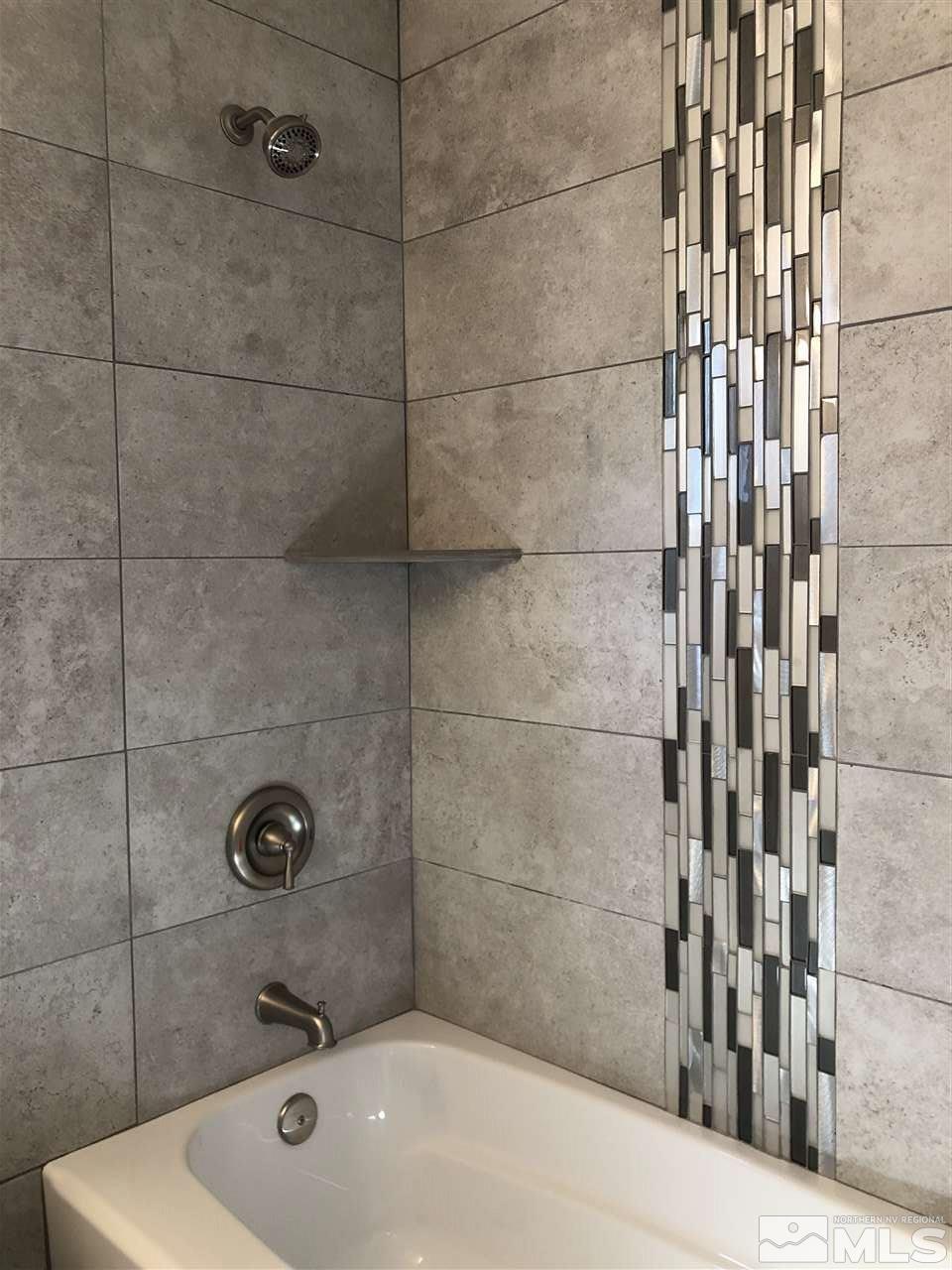 10028 Humite Lane Reno, NV 89506 - Photo 8 of 9 a bathroom with a shower