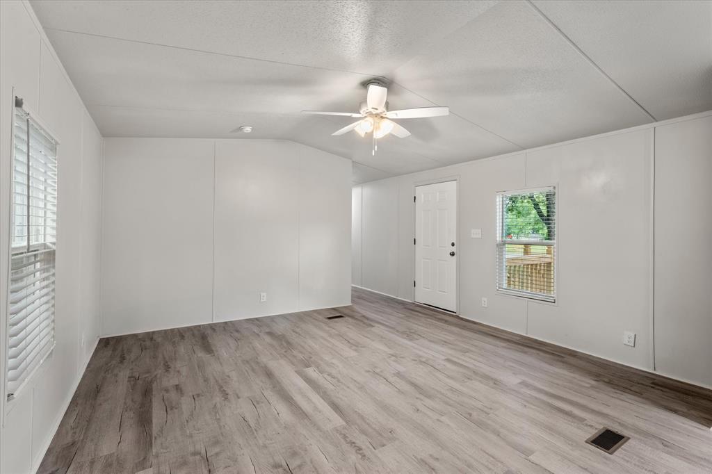 367 Box Road Gun Barrel City, TX 75156 - Photo 13 of 25 wooden floor in an empty room with a window