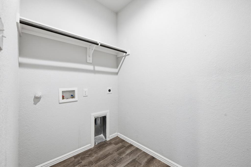 9308 Desertrock Road Fort Worth, TX 76131 - Photo 13 of 23 a view of small space with wooden floor and white wall
