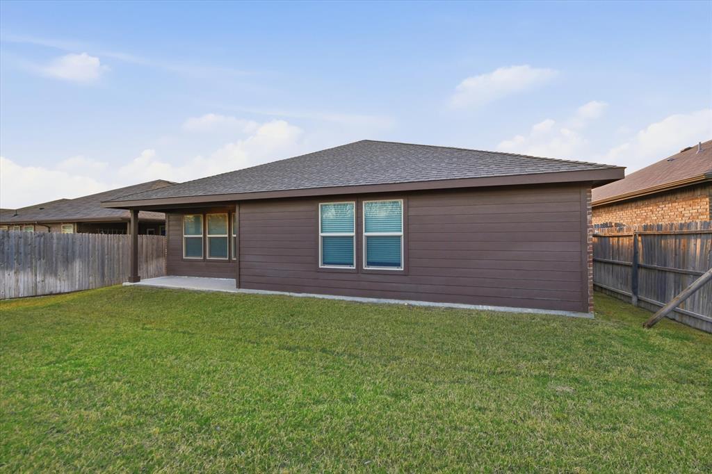 9308 Desertrock Road Fort Worth, TX 76131 - Photo 21 of 23 a front view of a house with a yard