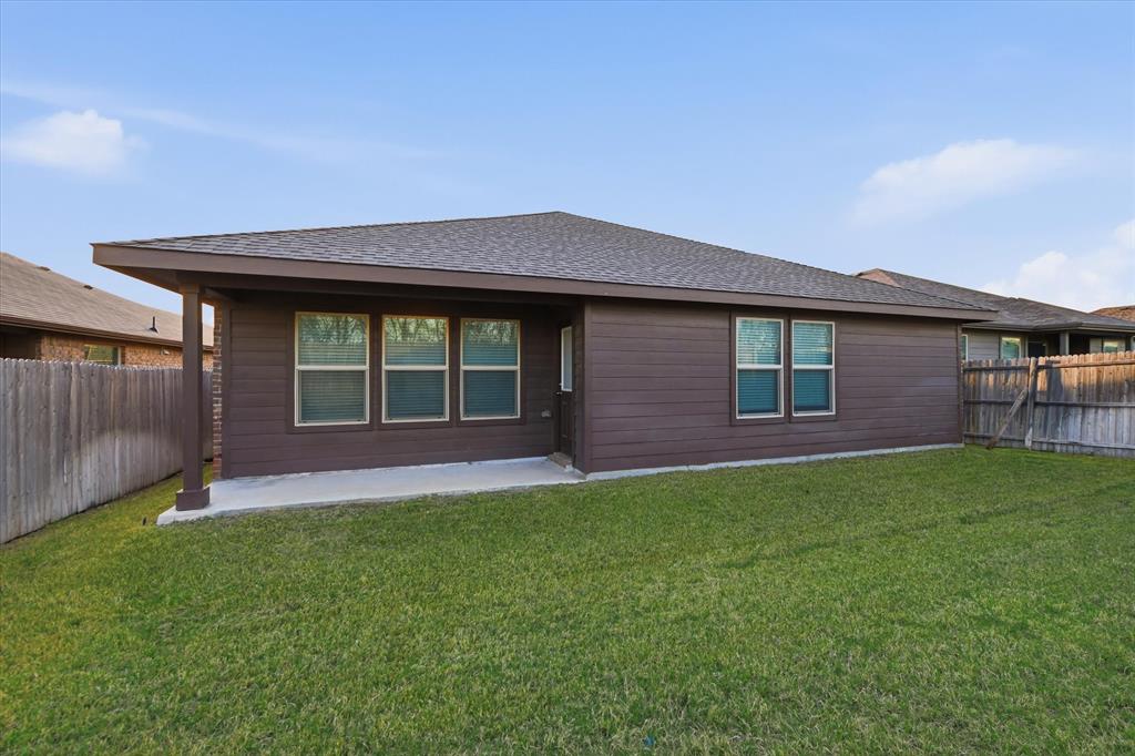 9308 Desertrock Road Fort Worth, TX 76131 - Photo 22 of 23 a view of front of a house with a yard
