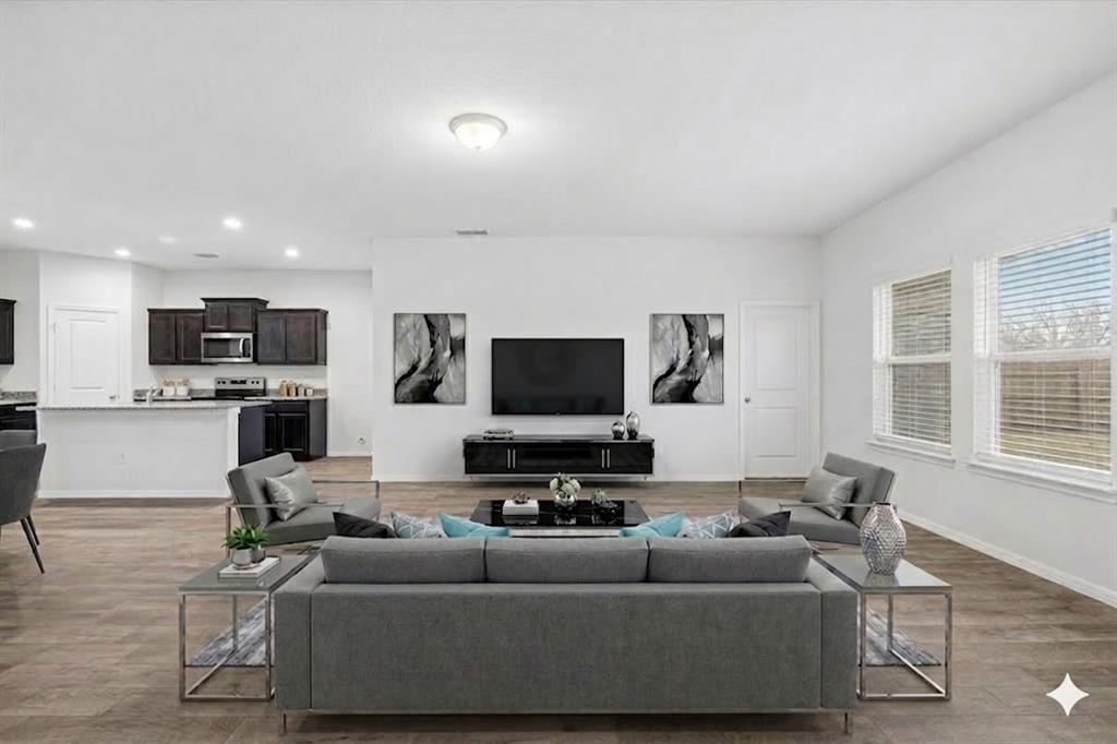 9308 Desertrock Road Fort Worth, TX 76131 - Photo 5 of 23 a living room with furniture and a flat screen tv