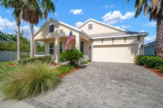 a front view of house with yard and outdoor seating
