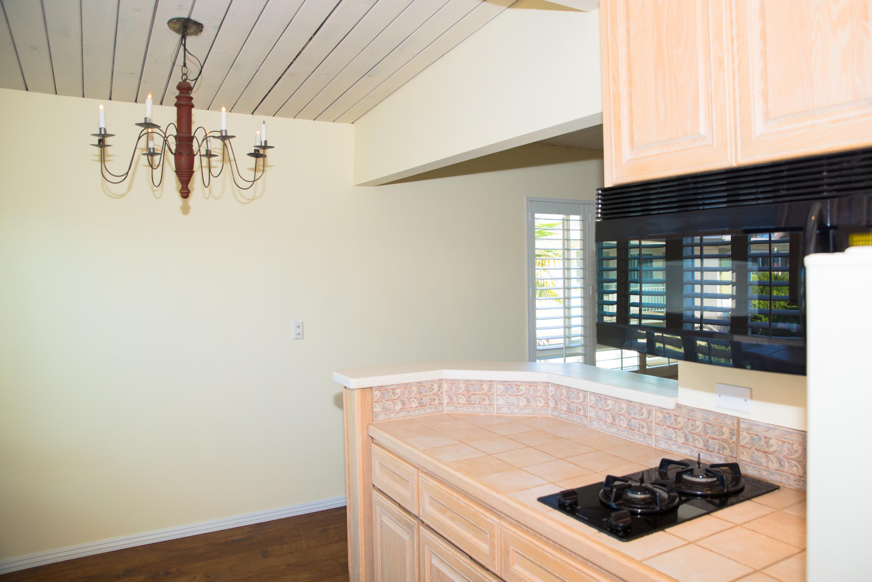 4950 Sandyland Road, Unit 220 Carpinteria, CA 93013 - Photo 10 of 20 a kitchen with a sink a stove and cabinets