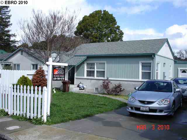 a front view of a house with a garden and porch