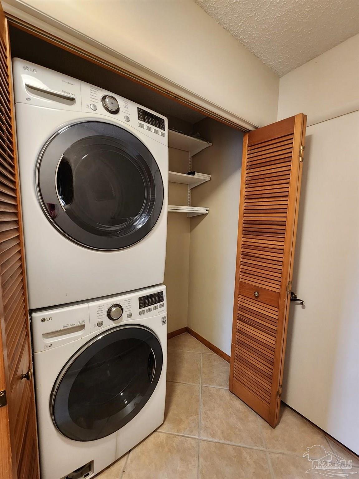 9001 Woodrun Road Pensacola, FL 32514 - Photo 18 of 24 a utility room with dryer and washer