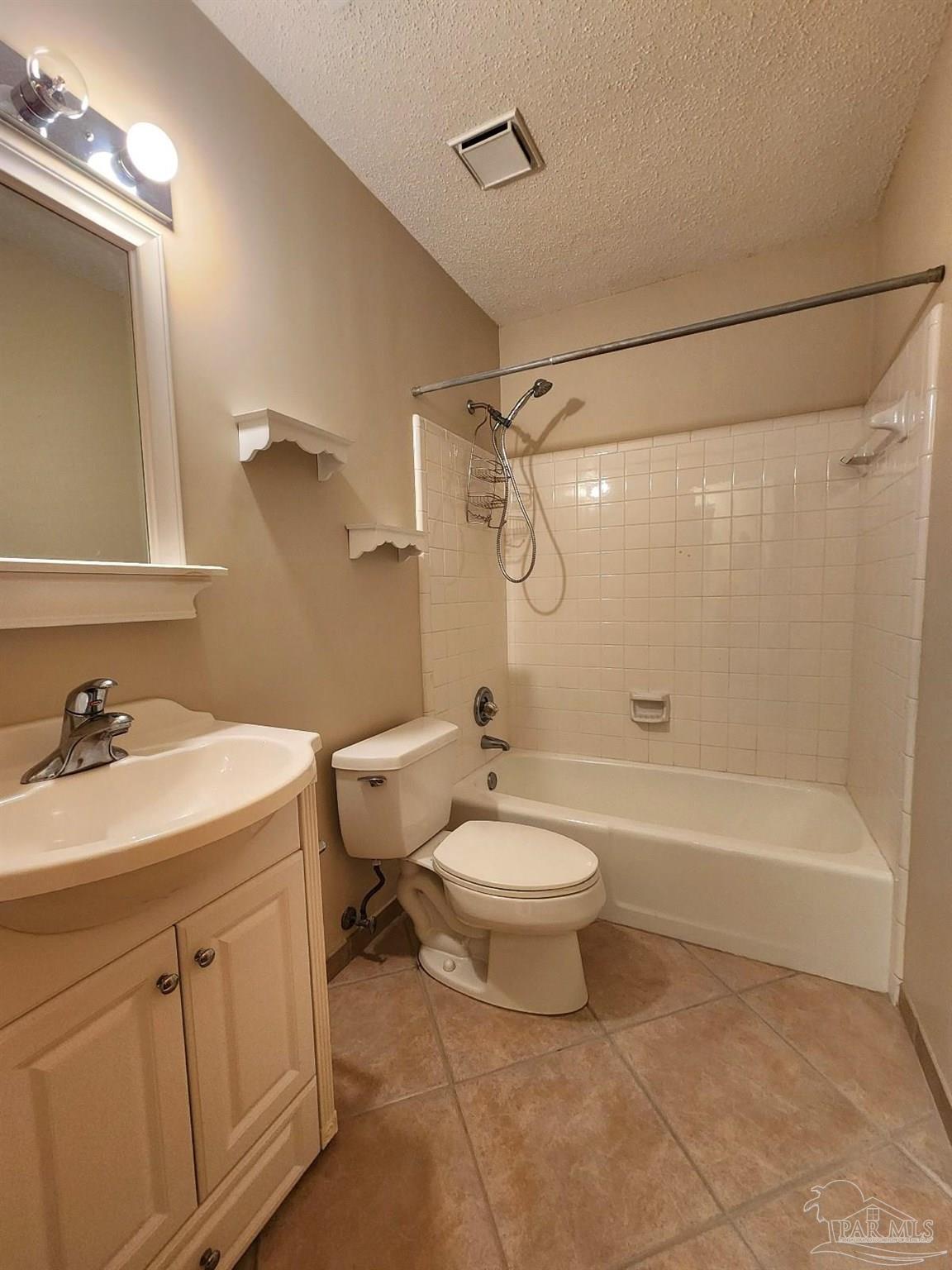 9001 Woodrun Road Pensacola, FL 32514 - Photo 22 of 24 a bathroom with a sink a toilet and a bathtub