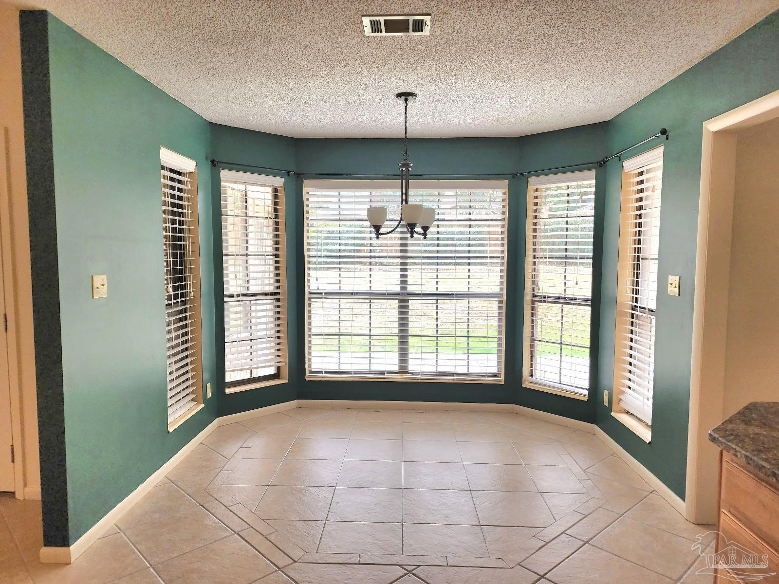 9001 Woodrun Road Pensacola, FL 32514 - Photo 3 of 24 a view of an empty room with a window