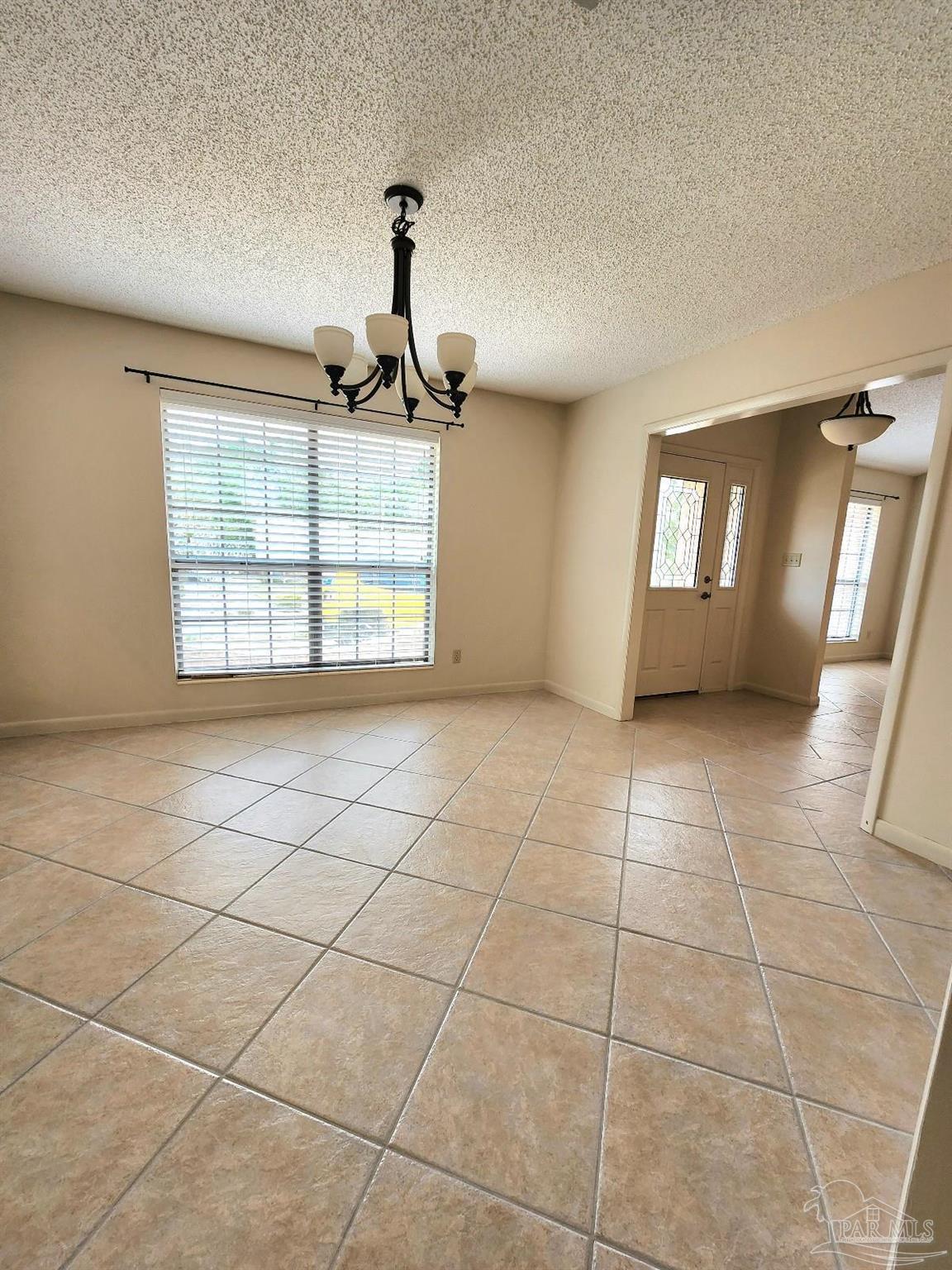 9001 Woodrun Road Pensacola, FL 32514 - Photo 10 of 24 a view of an empty room and window
