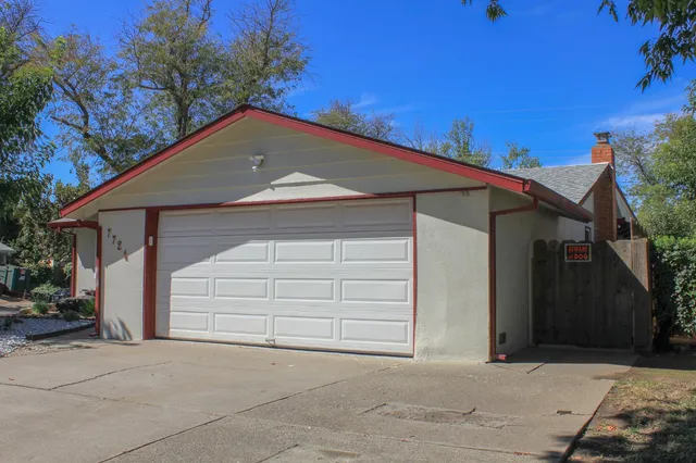 a house with a yard and garage