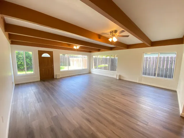 a view of livingroom with wooden floor and window