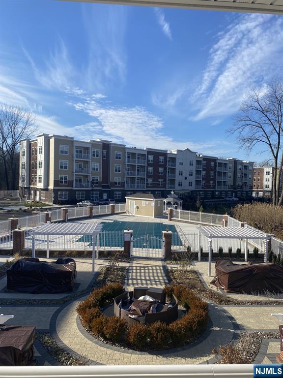 a view of a swimming pool with a patio