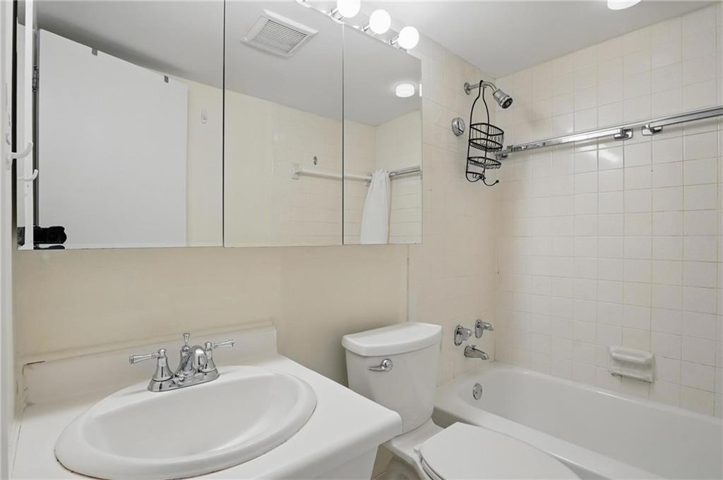 5 Bayard Road, Unit 400 Pittsburgh, PA 15213 - Photo 19 of 33 The bathroom with ample storage combines functionality with aesthetic appeal, offering organized spaces for toiletries, linens, and personal items while maintaining a clean and inviting atmosphere.