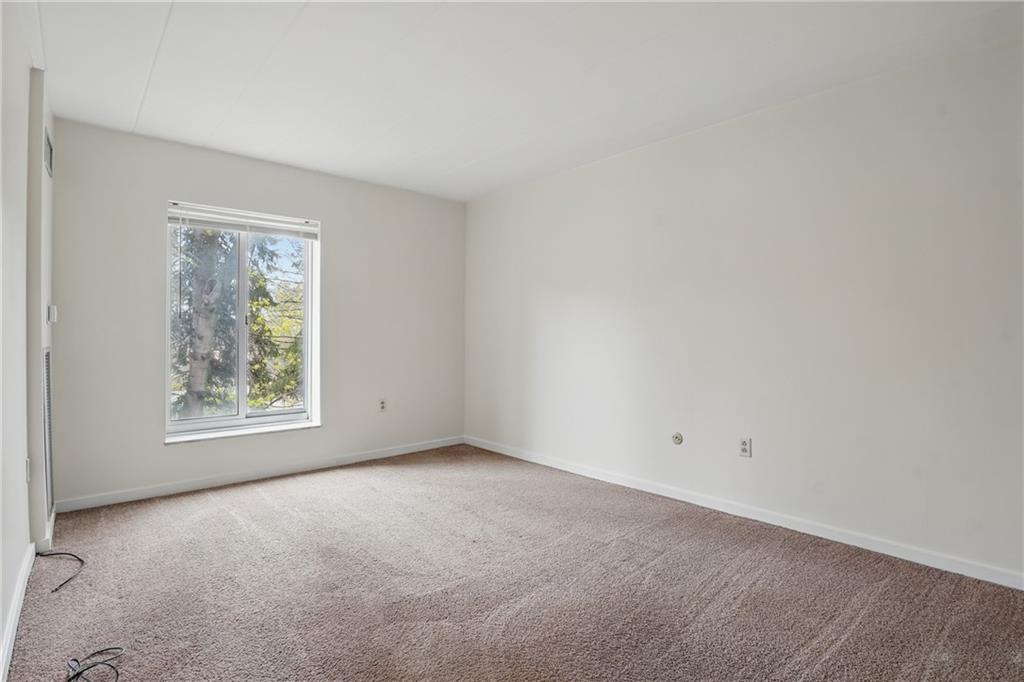 5 Bayard Road, Unit 400 Pittsburgh, PA 15213 - Photo 20 of 33 Natural light pours into the bedroom, creating an inviting and serene atmosphere.