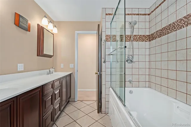 a bathroom with a tub a sink and shower