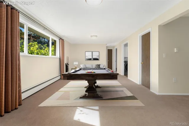 a living room with a table and a window