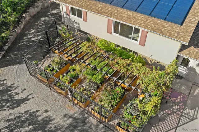 a view of a house with a flower garden