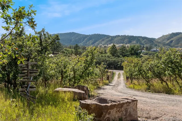 an aerial view of a house with a yard and garden