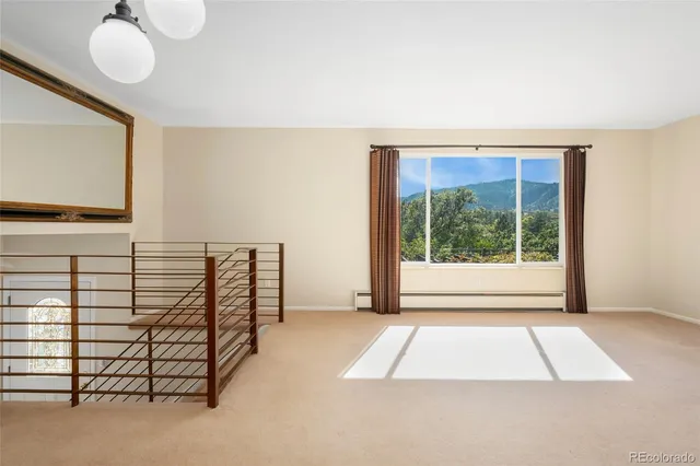 a view of a room with stairs and a couch