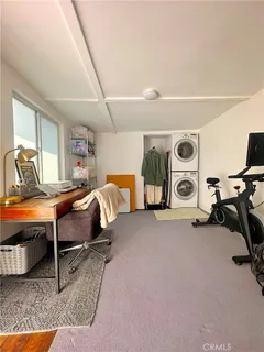 a bedroom with furniture and a air conditioner vent