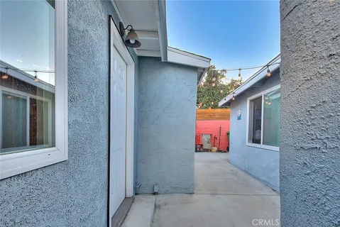 a view of a house with brick walls