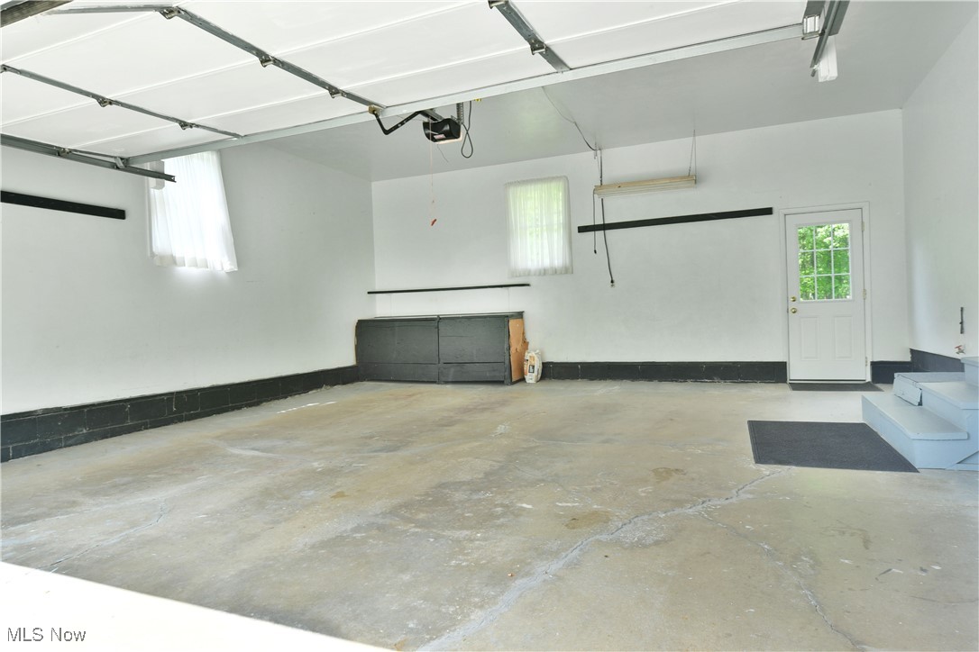 6509 Shaffer Road Northwest Warren, OH 44481 - Photo 12 of 50 Garage featuring a garage door opener