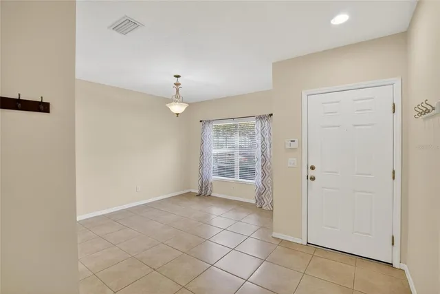 a view of a hallway with a chandelier