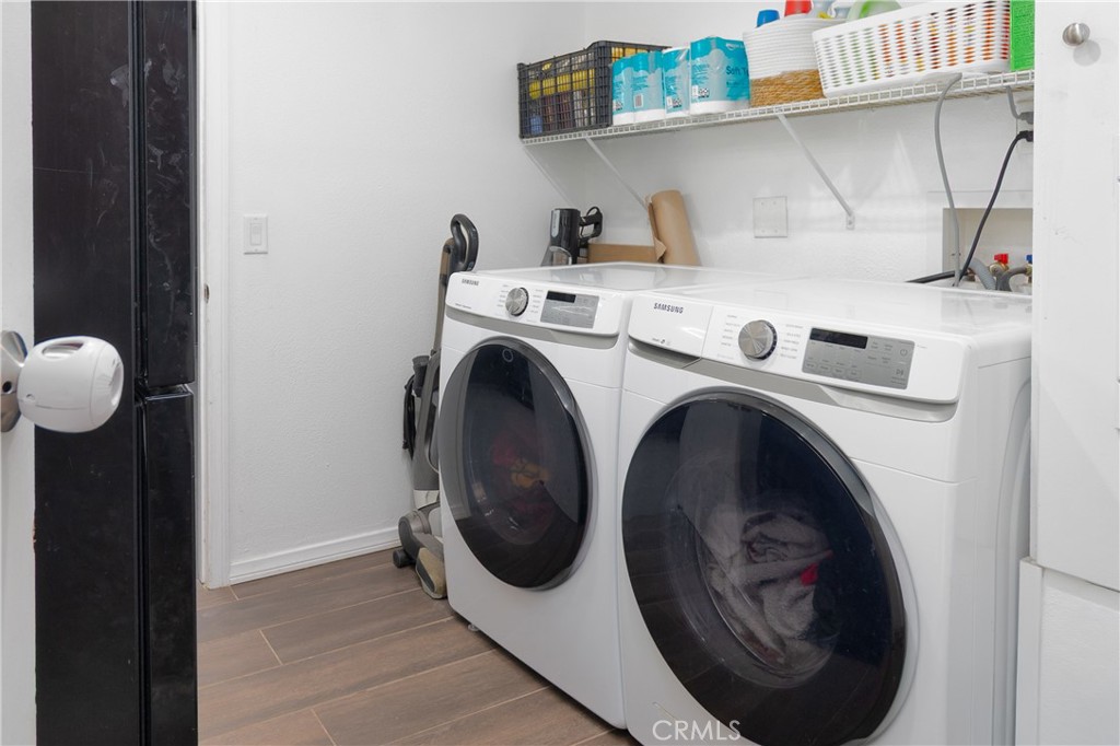 19801 Talihina Road Apple Valley, CA 92307 - Photo 22 of 32 a utility room with dryer and washer