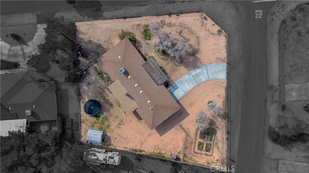 19801 Talihina Road Apple Valley, CA 92307 - Photo 4 of 32 an aerial view of a house with a swimming pool