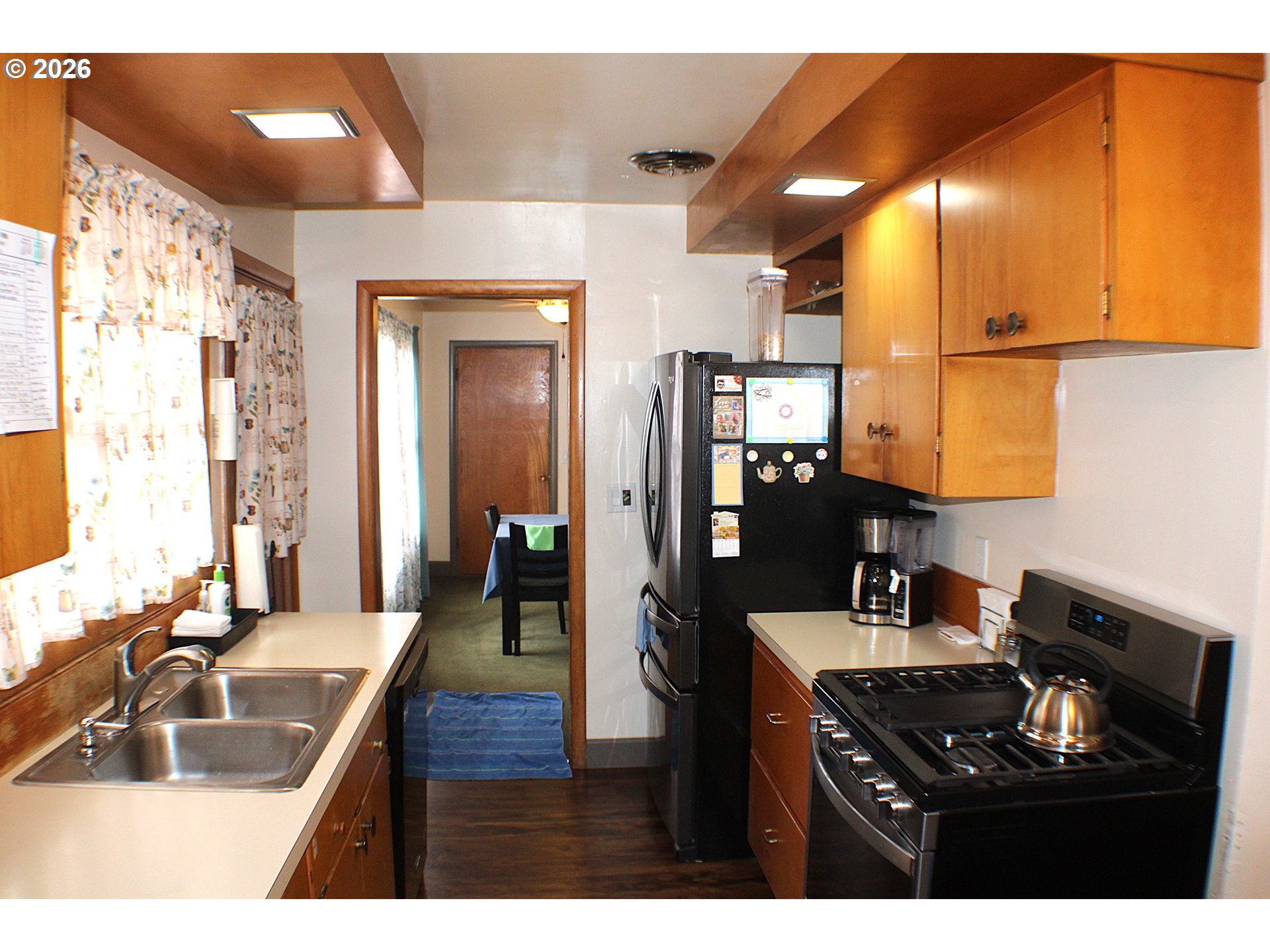 212 Park Street Riddle, OR 97469 - Photo 11 of 34 a kitchen with a sink stove and cabinets