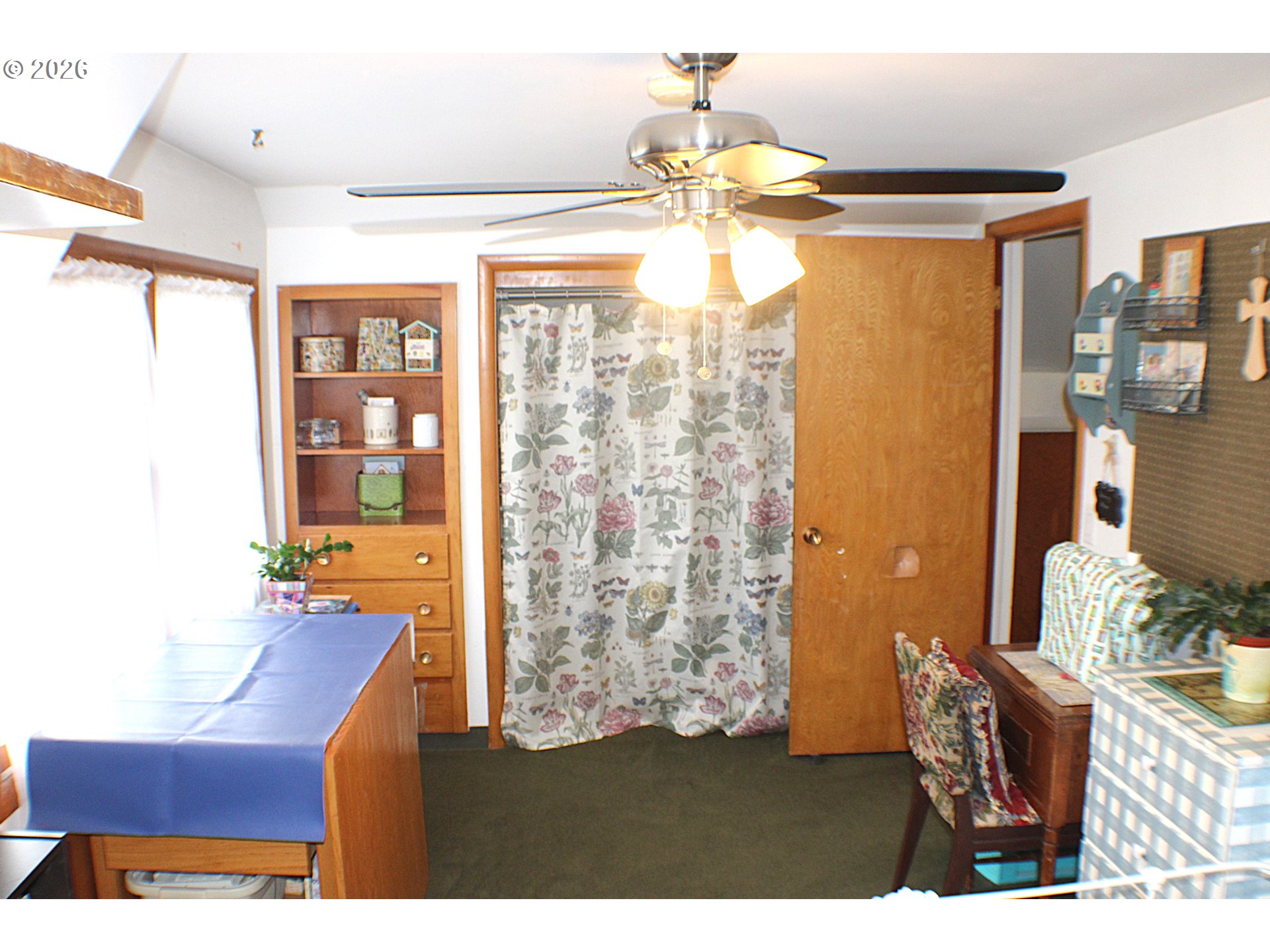 212 Park Street Riddle, OR 97469 - Photo 20 of 34 a room with furniture and a chandelier