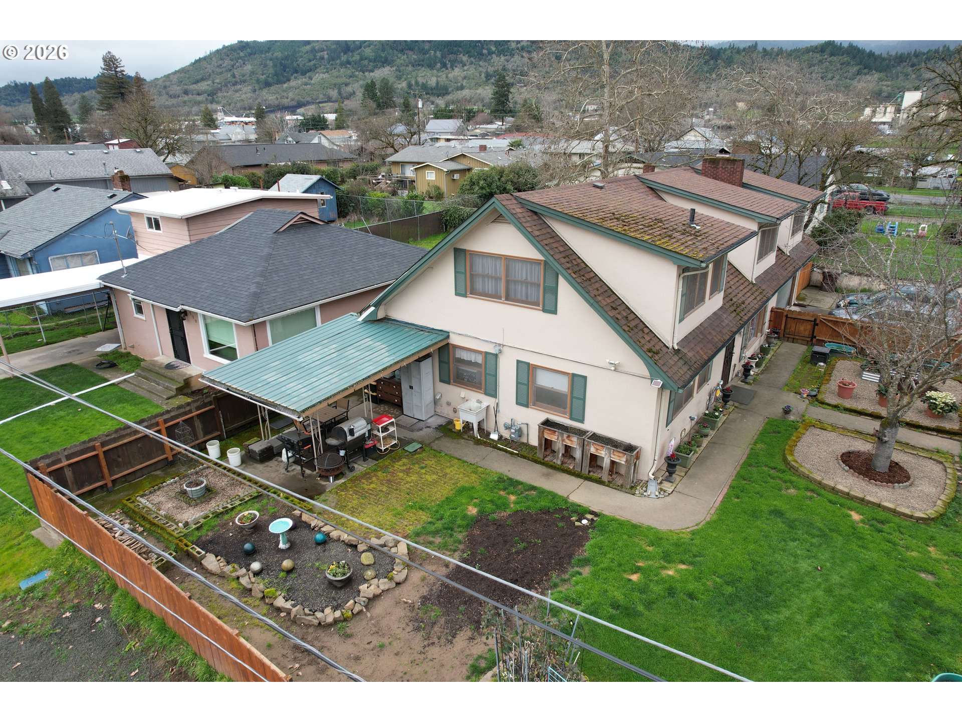 212 Park Street Riddle, OR 97469 - Photo 33 of 34 an aerial view of a house with a garden