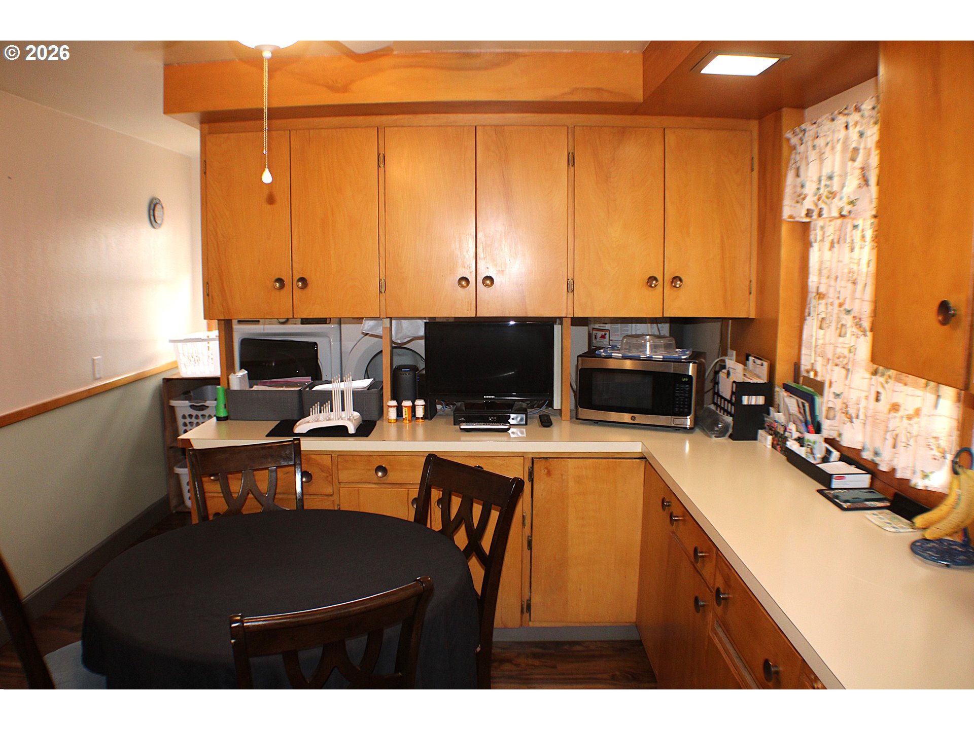 212 Park Street Riddle, OR 97469 - Photo 10 of 34 a kitchen that has a lot of cabinets in it and appliances