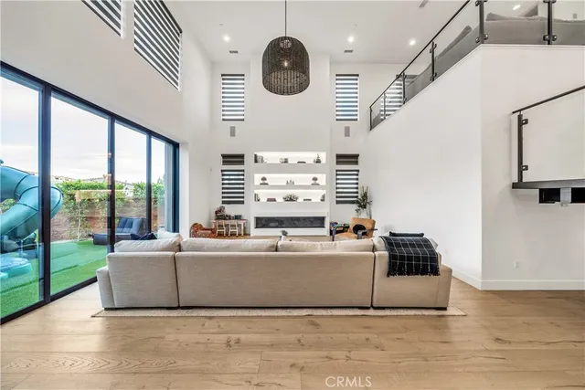 a living room with furniture and a lamp