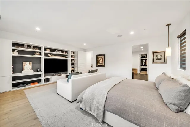 a view of a kitchen with kitchen island stainless steel appliances a stove top oven