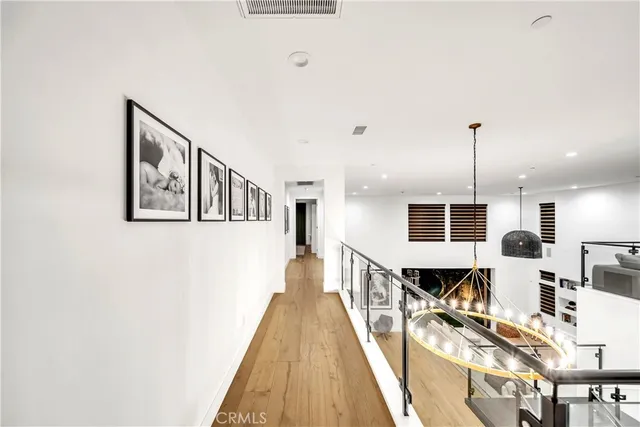 a large living room with stainless steel appliances kitchen island granite countertop furniture and a fireplace