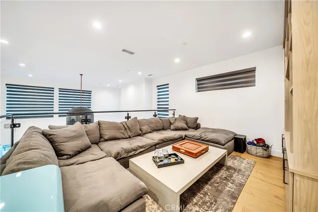 a living room with furniture fireplace and a flat screen tv