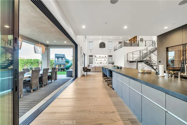a living room with large window and furniture