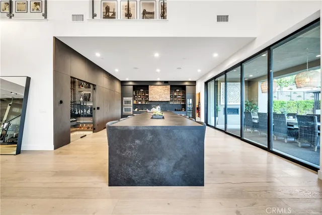 a view of a patio with dining table and chairs