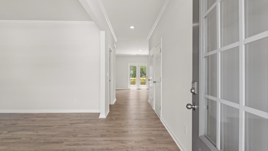 174 Thompson Ridge Lane Dallas, GA 30132 - Photo 3 of 35 a view of a hallway with wooden floor