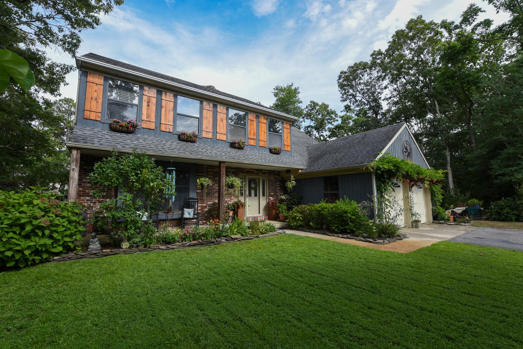 5 Inlet Ocean View, NJ 08230 - Photo 1 of 34 a front view of a house with a yard and trees