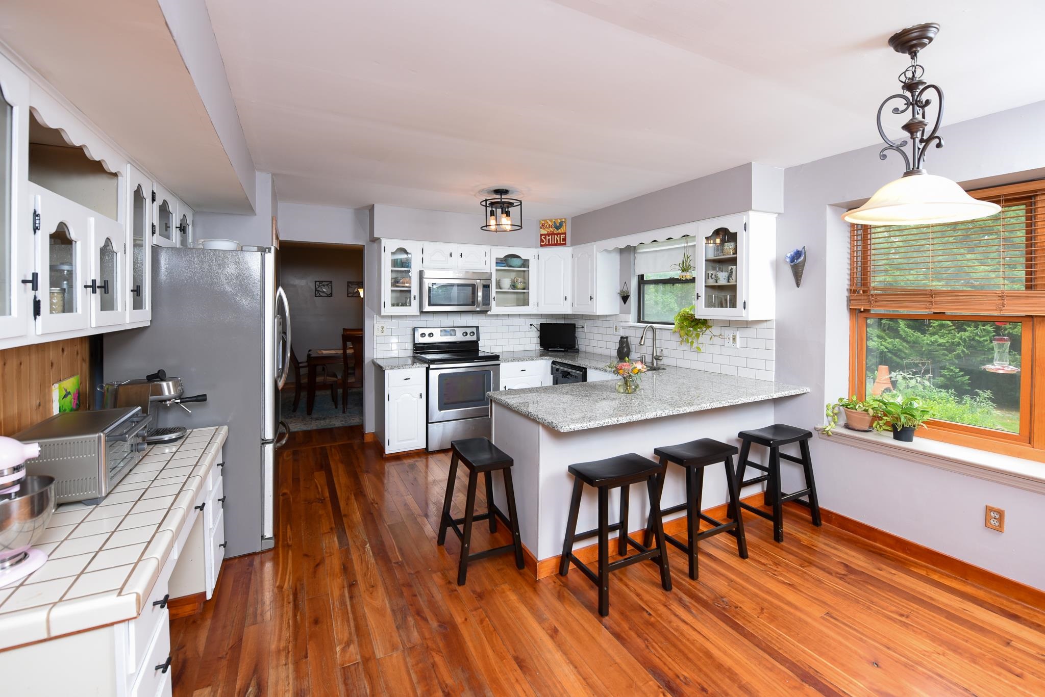 5 Inlet Ocean View, NJ 08230 - Photo 11 of 34 a kitchen with stainless steel appliances granite countertop a dining table chairs refrigerator and sink