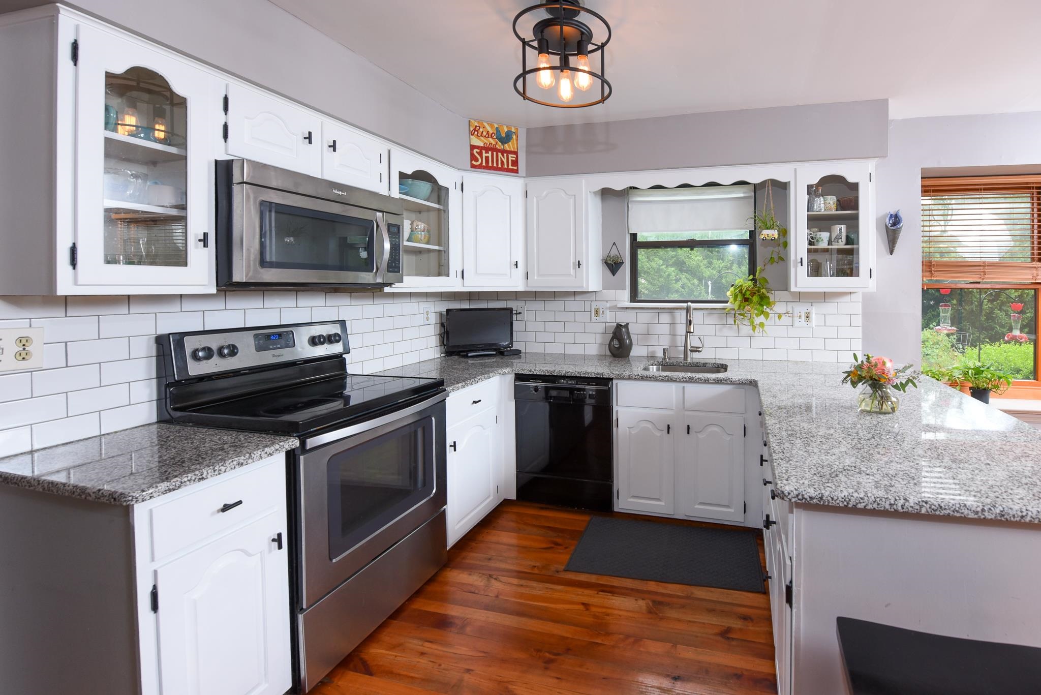 5 Inlet Ocean View, NJ 08230 - Photo 12 of 34 a kitchen with a sink stove and microwave