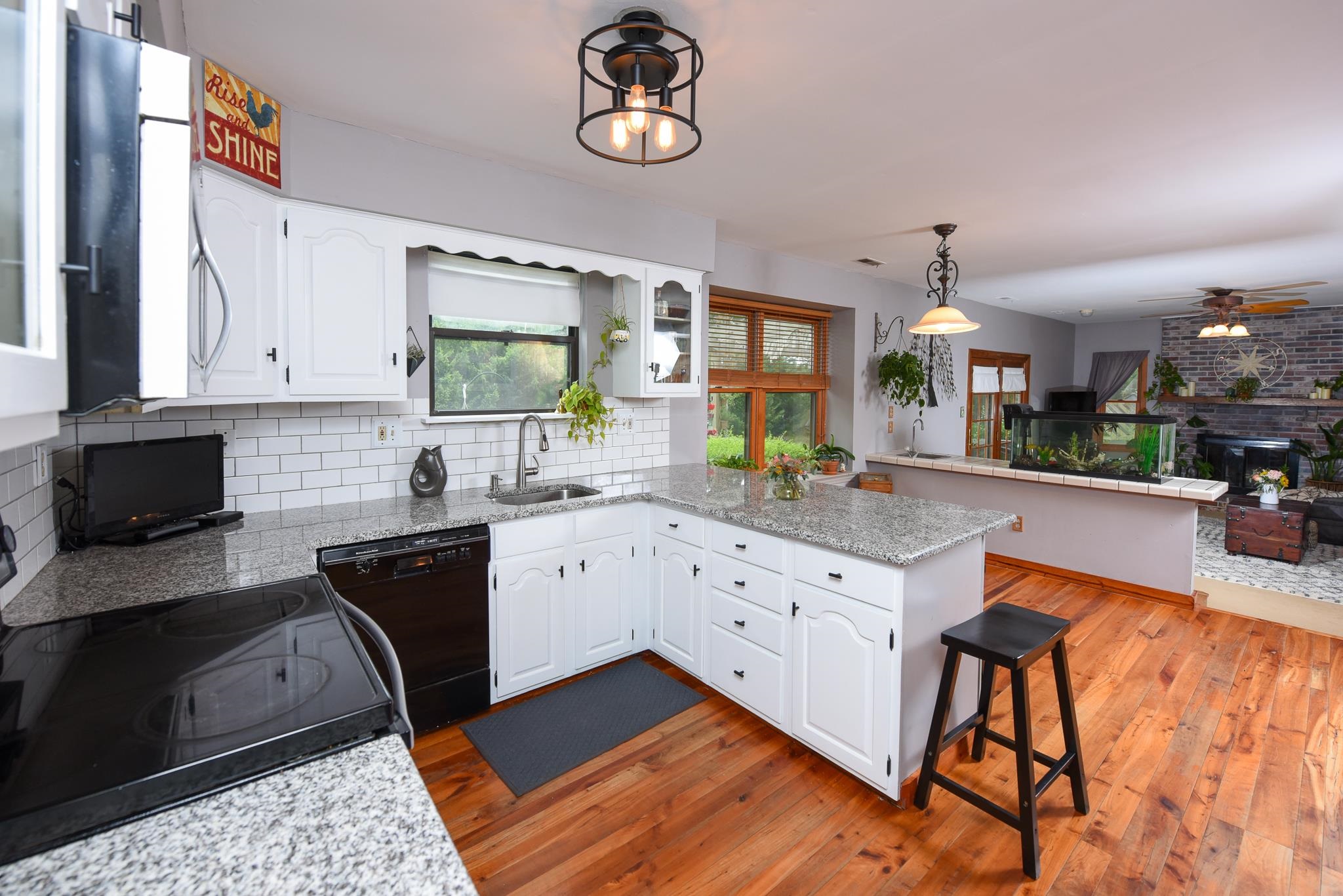 5 Inlet Ocean View, NJ 08230 - Photo 14 of 34 a kitchen with stainless steel appliances granite countertop a sink stove and cabinets