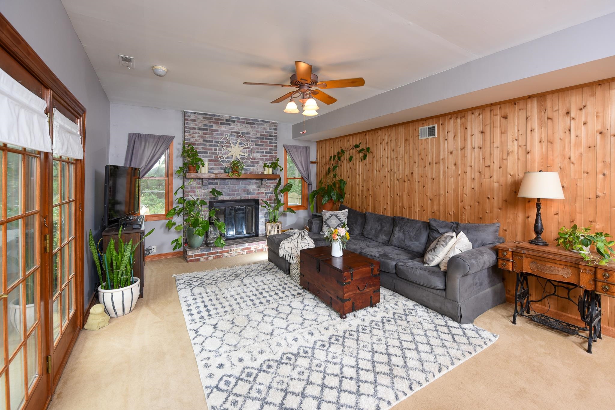 5 Inlet Ocean View, NJ 08230 - Photo 15 of 34 a living room with furniture a chandelier and a fireplace