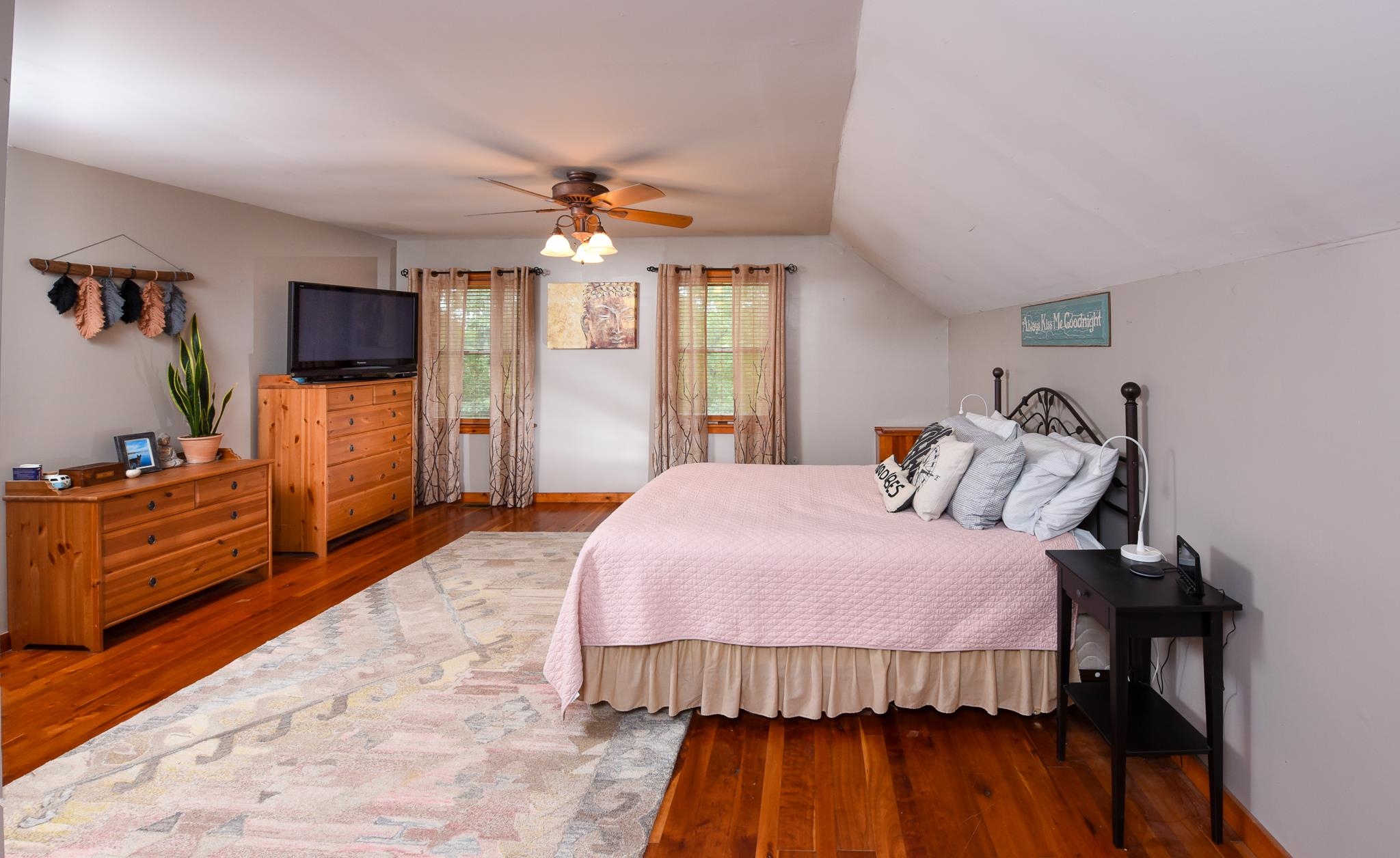 5 Inlet Ocean View, NJ 08230 - Photo 18 of 34 a bedroom with a bed and a flat screen tv
