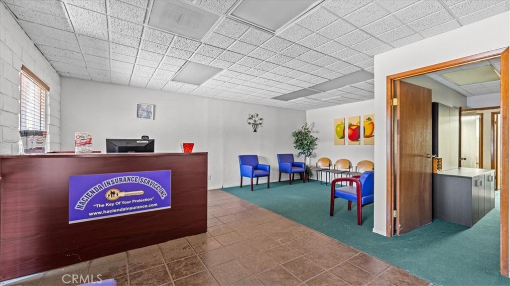 580 East Foothill Boulevard Azusa, CA 91702 - Photo 18 of 36 a bed room with a bed and a chandelier