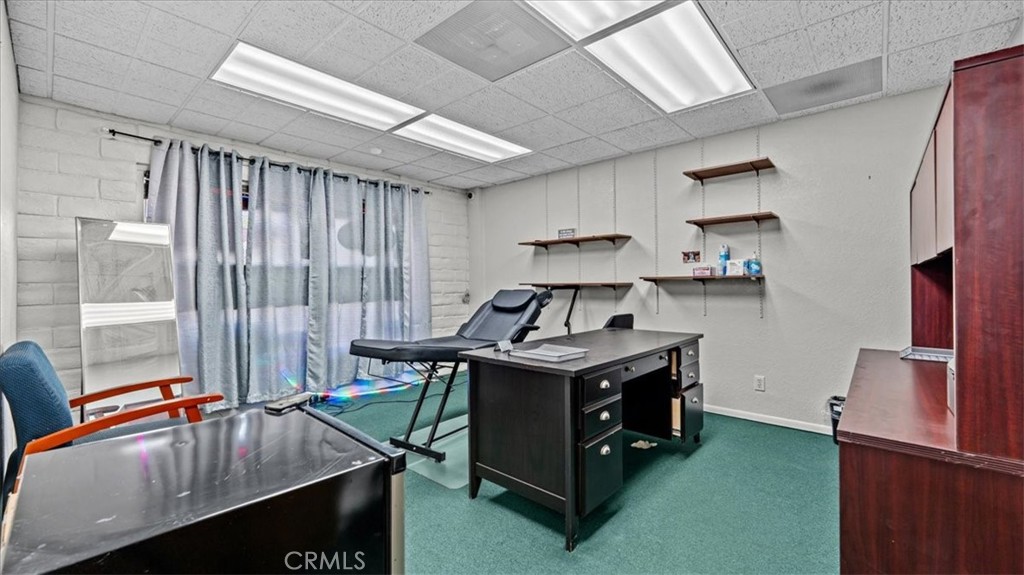 580 East Foothill Boulevard Azusa, CA 91702 - Photo 8 of 36 a kitchen with stainless steel appliances granite countertop a sink a stove and a refrigerator