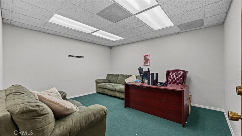 580 East Foothill Boulevard Azusa, CA 91702 - Photo 10 of 36 a living room with furniture and a couch